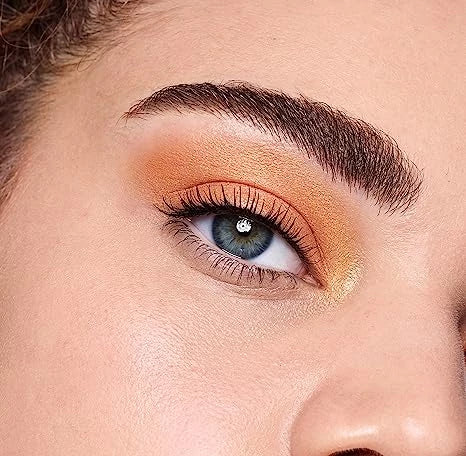 CoverGirl - Close up of orange eyeshadow and voluminous eyelashes